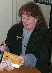 Kerry Greenwood signing books at the launch of Forbidden Fruit