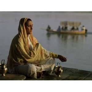  Hindu Woman Meditating Beside the River Ganges, Varanasi 