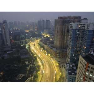  Car Lights Form Streaks on a Shanghai Roadway at Night 