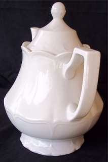 This quality Teapot is 8 1/2 tall and 9 wide from spout through the 
