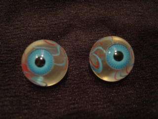 Realistic clear eyeballs with blue iris and painted blood vessels 