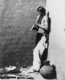 1908 Native American Indian playing wind instrument  