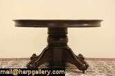   oak dining table has a spectacular carved pedestal with eagle talon or
