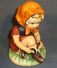 arnart 5th ave girl tieing shoe hand painted figurine 1554