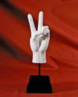 The universal sign for peace or victory. A sculptural hand cast in 